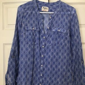 Blue tunic Anthropology (holding horses)